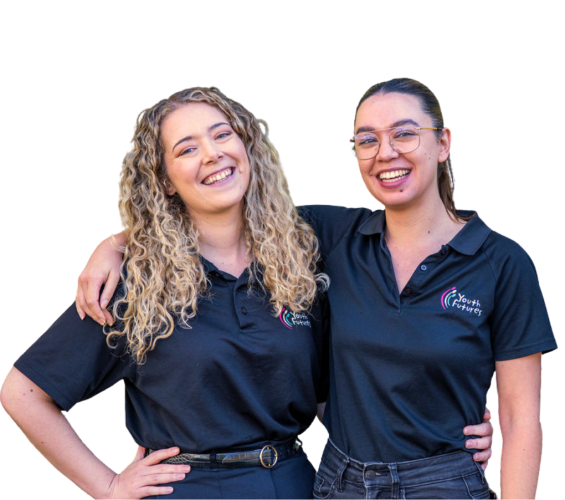 Two female youth futures volunteers looking at the camera smiling with arms around one another