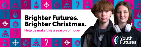 Two young children on the brighter futures brighter christmas banner