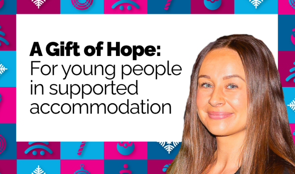 Danielle's face in front of the brighter christmas campaign banner